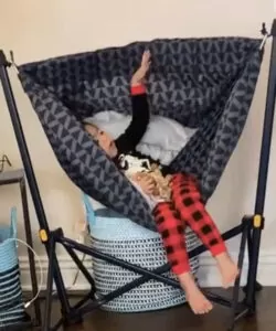 Little girl in a hammock swing